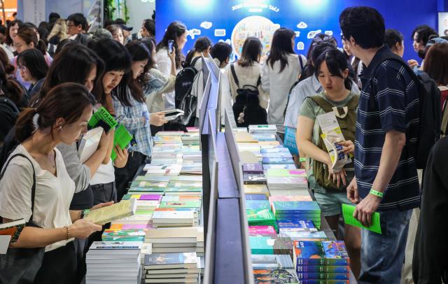 Visitors browse exhibition booths during the 2026 Seoul International Book Fair at COEX in Gangnam-gu, Seoul, on June 23, 2026. AJP Yoo Na-hyun