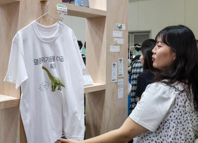 Visitors browse book-related merchandise during the 2026 Seoul International Book Fair at COEX in Gangnam-gu, Seoul, on June 23, 2026. AJP Yoo Na-hyun