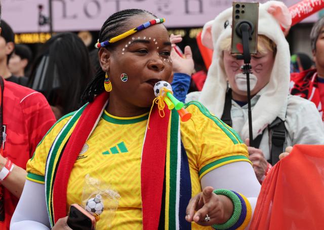 A South African supporter blows a vuvuzela at Gwanghwamun Square during South Africas 1-0 World Cup victory over South Korea on June 25 2026 AJP Yoo Na-hyun