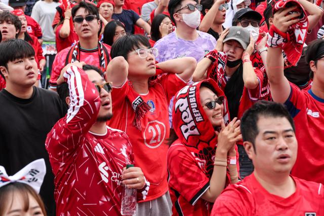 South Korean supporters watch the broadcast screen with anxious faces as South Africa threatens to score during their 2026 FIFA World Cup Group A match at Gwanghwamun Square on June 25 2026 AJP Yoo Na-hyun