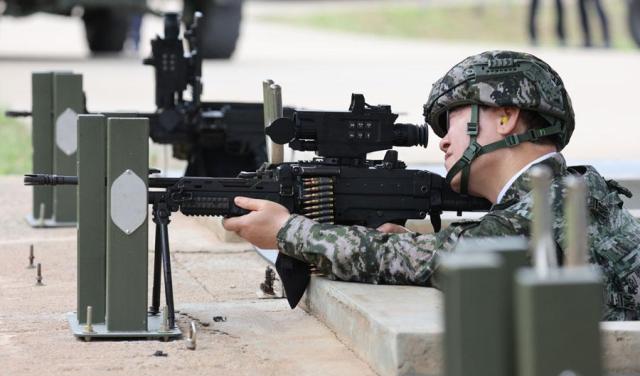 President Lee Jae Myung fires a K15 machine gun during a visit to a military unit on Yeonpyeong Island on June 24 2026  Yonhap
