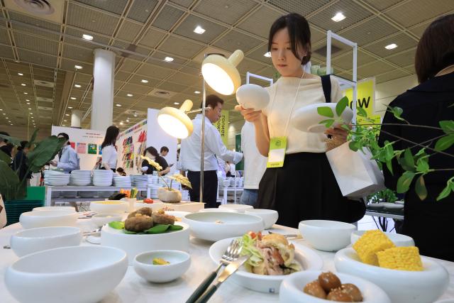 Visitors browse exhibition booths at THE MAISON 2026 a premium lifestyle fair held at COEX in Samseong-dong Gangnam-gu Seoul on June 26 2026 AJP Han Jun-gu