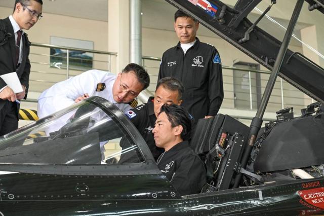 Japanese Defense Minister Shinjiro Koizumi center takes a ride in a Black Eagles aircraft at an air base in Wonju Gangwon Province on June 27 2026 Yonhap