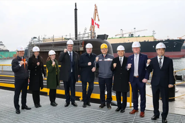Stephen Fuhr Canadas secretary of state for defense procurement fifth from left and members of the Canadian delegation visiting Geoje shipyard on Feb 2 2026 Courtesy of Hanwha Group
