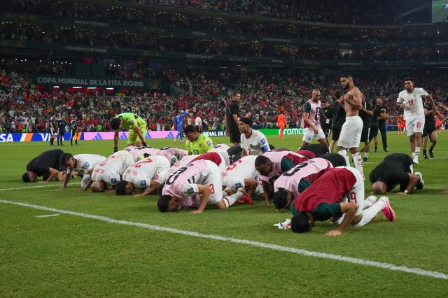 Morocco players pray facing Mecca after beating the Netherlands in a penalty shootout in their 2026 FIFA World Cup round-of-32 match at Estadio Monterrey in Guadalupe Mexico on June 29 2026 APYonhap