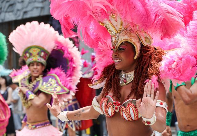 Lotte World Adventure performers stage a samba performance to celebrate the opening of the theme parks summer festival on UNESCO Street in Seouls Myeong-dong district on July 1 2026 AJP Yoo Na-hyun
