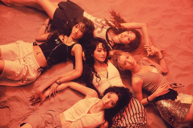 A group concept photo for i-dles ninth EP We made released July 1 as part of the albums summer-themed promotion Courtesy of Cube Entertainment