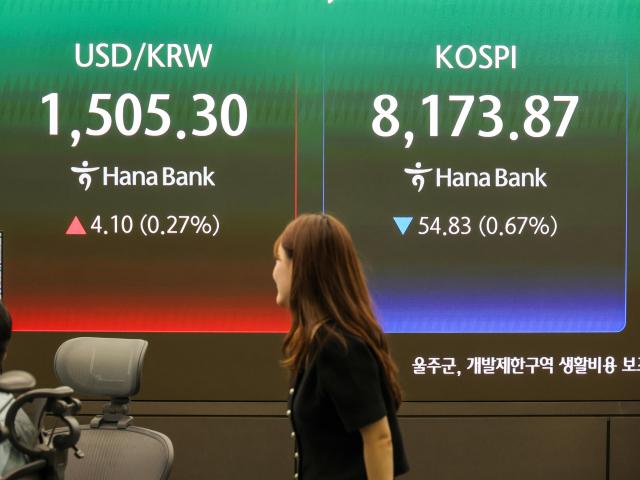 Exchange rates and stock prices are displayed on an electronic board at Hana Bank’s dealing room in Seoul on May 28 2026 Hana Bank plans to operate a 24-hour foreign-exchange trading system through coordination with its London branch AJP Yoo Na-hyun