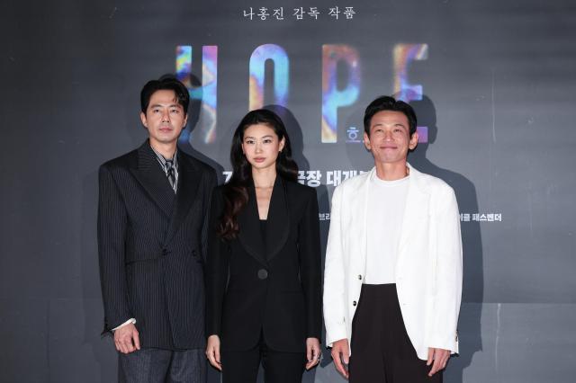 Actors Hwang Jung-min Zo In-sung and Jung Ho-yeon pose during a press screening and press conference for the film Hope at COEX in Seoul on July 6 2026 AJP Yoo Na-hyun