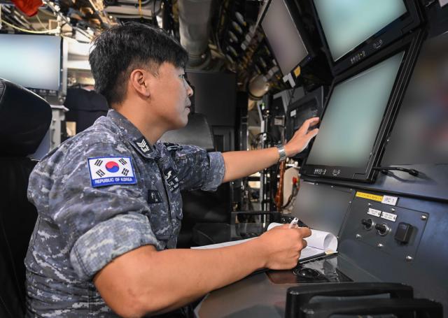 South Korean sailors inspect equipment aboard the ROKS Dosan Ahn Chang-ho at Joint Base Pearl Harbor-Hickam in Hawaii on July 5 2026 during the Rim of the Pacific Exercise Courtesy of the Republic of Korea Navy