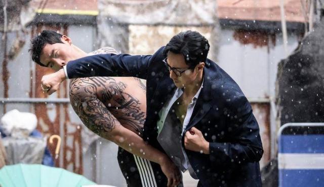 So Ji-subs character delivers a fight scene in the rain in a still from Agent Kim Reactivated Courtesy of SBS