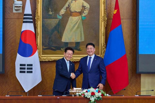 South Korean President Lee Jae Myung left shakes hands with Mongolian President Ukhnaagiin Khürelsükh during their summit in Ulaanbaatar Mongolia on July 9 2026 Courtesy of Cheong Wa Dae