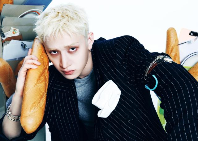 Bang Chan of Stray Kids poses for a concept photo ahead of the groups new EP THIS  THAT Courtesy of JYP Entertainment