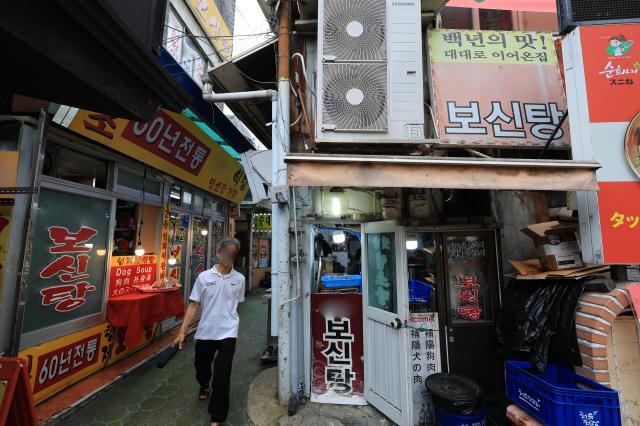 A diner leaves a dog meat restaurant on a traditional dog meat alley in Jongno-gu Seoul on July 14 2026 AJP Han Jun-gu