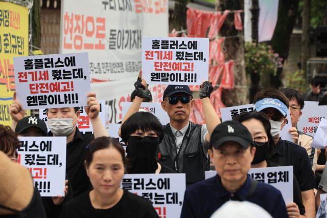 Members of the National Homeplus Tenant Owners Association hold a rally outside Cheong Wa Dae in Jongno-gu Seoul on July 15 2026 demanding the government guarantee their survival and operating rights amid the Homeplus crisis AJP Han Jun-gu