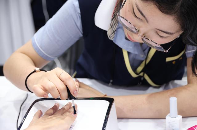 Visitors experience interactive booths during the 2026 Seoul Career and Vocational Expo at the aT Center in Yangjae Seoul on July 16 2026 AJP Yoo Na-hyun