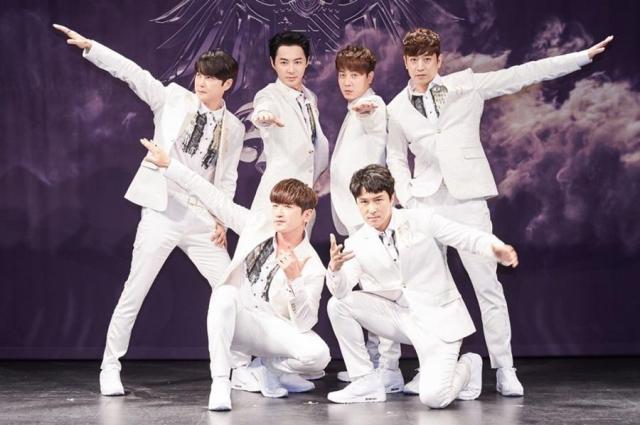 This photo provided by Shinhwa Company show member of K-pop boy group Shinhwa