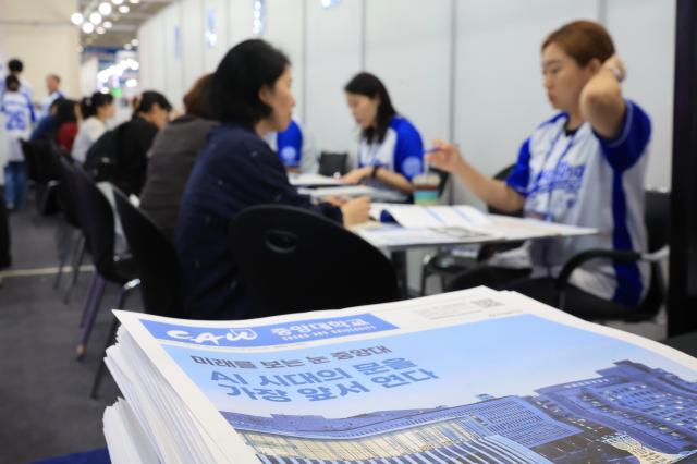 Applicants and parents receive counseling at the 2027 Early Admissions Fair held at COEX in Gangnam-gu Seoul July 23 2026 AJP Han Jun-gu