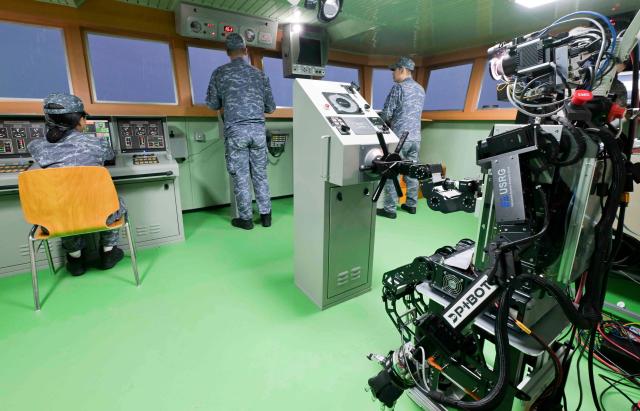 Humanoid robot PIBOT steers a ship during a Navy combat trial on July 23 Courtesy of the Republic of Korea Navy
