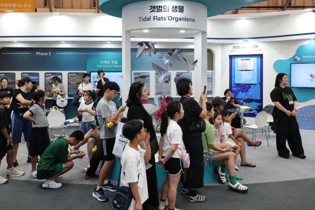 Visitors explore the Korea Pavilion the official host country exhibition held alongside the 48th session of the UNESCO World Heritage Committee at BEXCO in Busan on July 24 2026 AJP Yoo Na-hyun