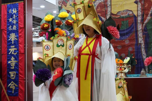 Visitors take part in a Yeongsanjae experience at the Korea Pavilion the official host country exhibition held alongside the 48th session of the UNESCO World Heritage Committee at BEXCO in Busan on July 24 2026 AJP Yoo Na-hyun