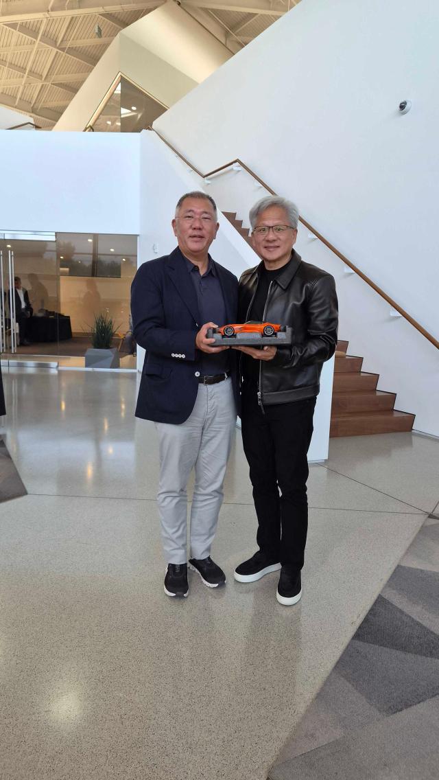 Nvidia CEO Jensen Huang right poses for a picture with Hyundai Motor Group Chairman Chung Eui-sun at Nvidia Headquartes in California July 24 2026 Courtesy of Nvidia