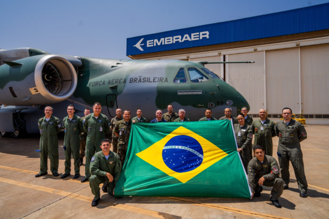 Brazilian Air Force personnel pose in front of a C-390 Millennium aircraft during Embraer’s delivery of the seventh C-390 to the Brazilian Air Force in Gavião Peixoto Brazil on Sept 27 2024 Courtesy of Embraer