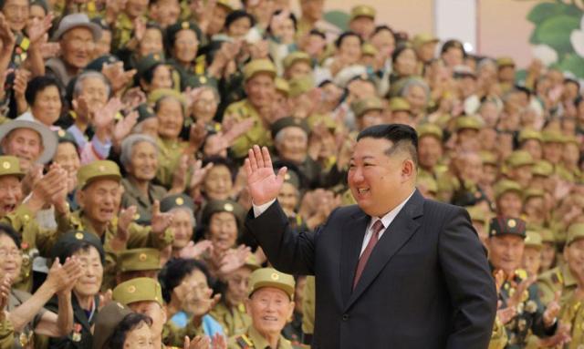 North Korean leader Kim Jong-un center meets with war veterans at an event in Pyongyang on June 28 2026 in this photo released by the state-run North Korean Central News Agency the following day