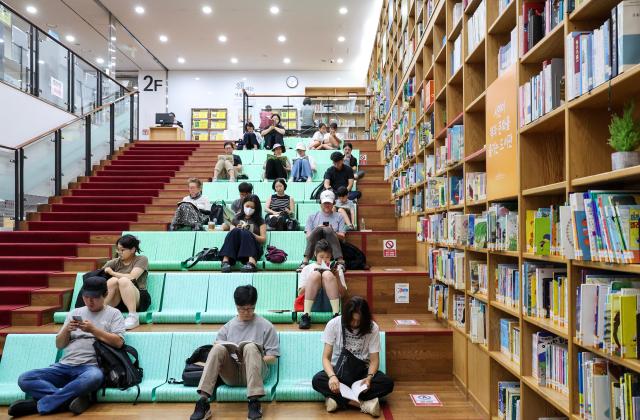 People read books to escape the heat at Seoul Metropolitan Library in Jung District central Seoul as the daytime high reached 32 degrees Celsius on July 28 2026 AJP Yoo Na-hyun