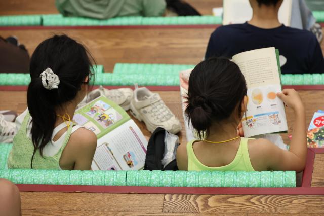 People read books to escape the heat at Seoul Metropolitan Library in Jung District central Seoul as the daytime high reached 32 degrees Celsius on July 29 2026 AJP Yoo Na-hyun