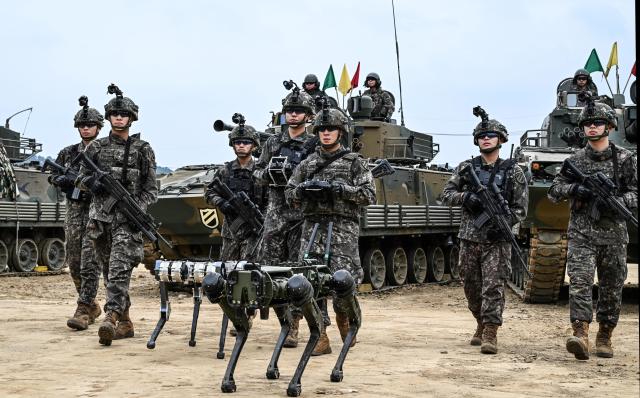 Army tests combat squad pairing soldiers with drones, robot dogs