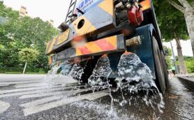 Water trucks cool down roads amid heat wave