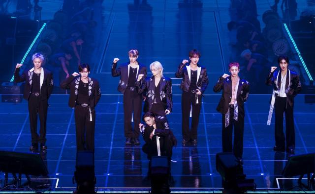 This photo provided by JYP Entertainment show members of K-pop boy group Stray Kids performing throughout their world tour 'Run IT.'