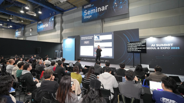 A speaker gives a presentation on AI agent growth during a seminar session at AI Summit Seoul  Expo 2025 at COEX in southern Seoul Courtesy of COEX