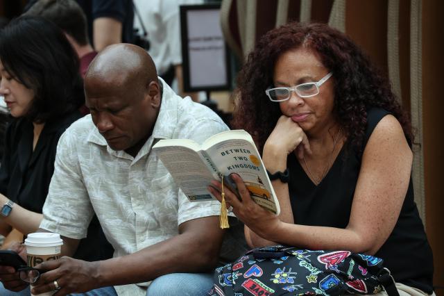 Foreigners enjoying reading time at airconditioned Starfield Library at COEX southern Seoul AJP Yoo Na-hyun July 16 2026