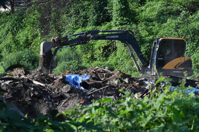 An excavator clears soil and debris at a redevelopment site in Guryong Village southern Seoul on Aug 4 2026 AJP Joonha Yoo