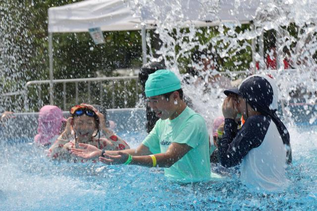 Children enjoy the water at the 2026 Seoul Summer Beach swimming pool at Gwanghwamun Square in central Seoul on July 28 2026 Aju Business Daily Yoo Na-hyun