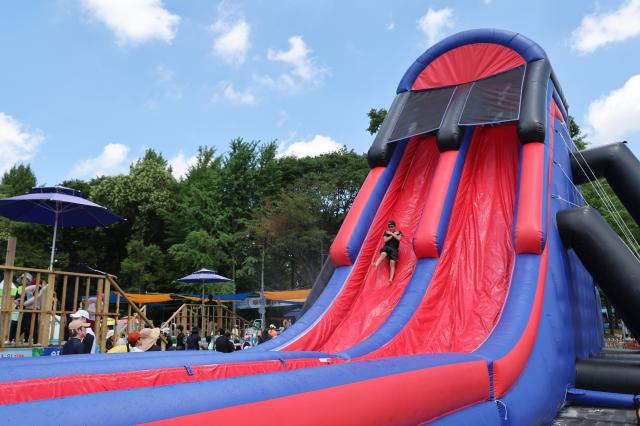 People ride a water slide at the Honey Jam Water Park in Nowon District northern Seoul on July 29 2026 Aju Business Daily Yoo Na-hyun
