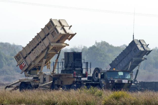 In this file photo taken on Oct 22 2012 two Patriot missile batteries are deployed on a field close to Atlit on the outskirts of Haifa Israel AFP-Yonhap