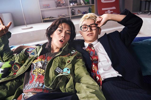 NCT 127s Taeyong and Yuta strike a laid-back pose in a new concept photo for the ASSEMBLE series released ahead of the groups seventh full album BLINGY Courtesy of SM Entertainment