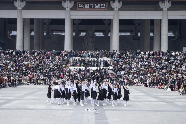 Students dressed in period costume perform during a reenactment of the March First Independence Movement at the Independence Hall of Korea in Cheonan South Chungcheong Province March 1 2023 marking the 104th anniversary of the movement Photo courtesy of the Independence Hall of Korea