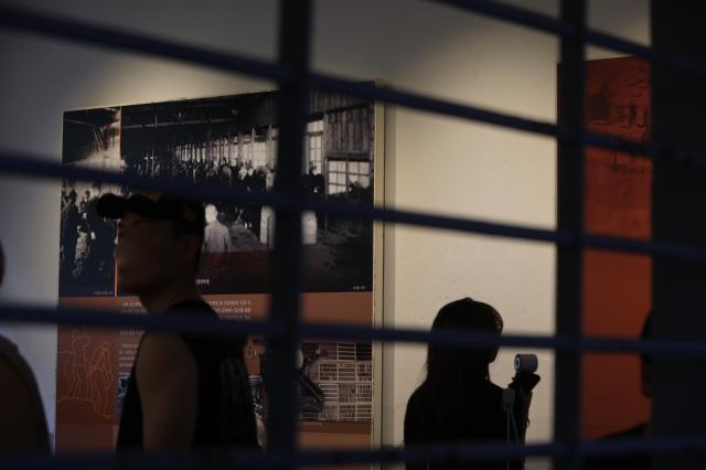 Visitors tour the inside of a cell block at Seodaemun prison history hall in Seoul August 14 2026 AJP Han Jun-gu