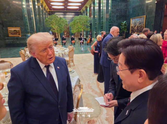 South Korean President Lee Jae Myung right speaks with US President Donald Trump during a reception and welcome dinner hosted by Turkish President Recep Tayyip Erdogan on the sidelines of the NATO summit in Ankara Turkey on July 7 2026 The two leaders discussed Korea-US cooperation including shipbuilding and security issues Photo from the Cheong Wa Dae website