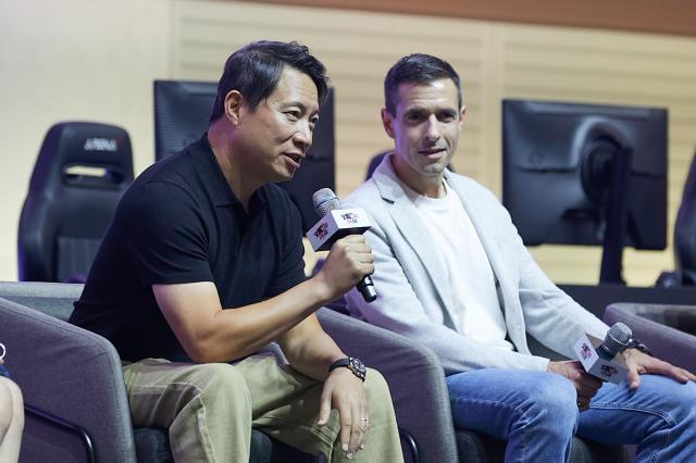 Walter Kong left Blizzard senior vice president and head of development for live games and mobile speaks during a conference session held at 