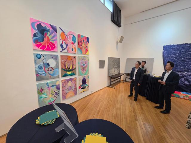 Visitors view works on display at the closing reception for the Tropismo artist residency at Brazil Hall in Samcheong-dong Seoul on Aug 21 2026 AJP Park Sae-jin