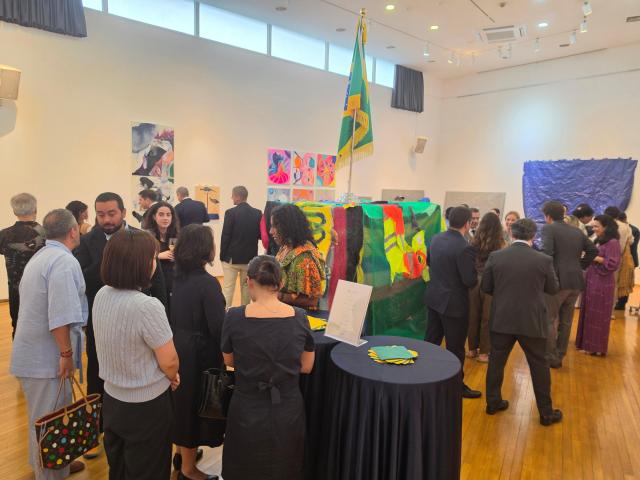 Visitors view works on display at the closing reception for the Tropismo artist residency at Brazil Hall in Samcheong-dong Seoul on Aug 21 2026 AJP Park Sae-jin
