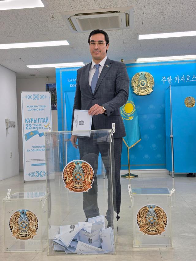 Kazakh Ambassador to South Korea Asset Issenali votes at the embassy in Seoul on August 23 AJP Park Sae-jin