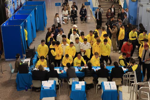 Citizens gather to receive ballots at a polling station in Astana Kazakhstan August 23 2026 AJP Han Jun-gu