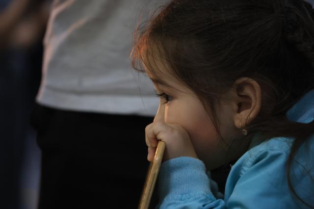 A child waits while his father votes at a polling station in Astana Kazakhstan August 23 2026 AJP Han Jun-gu