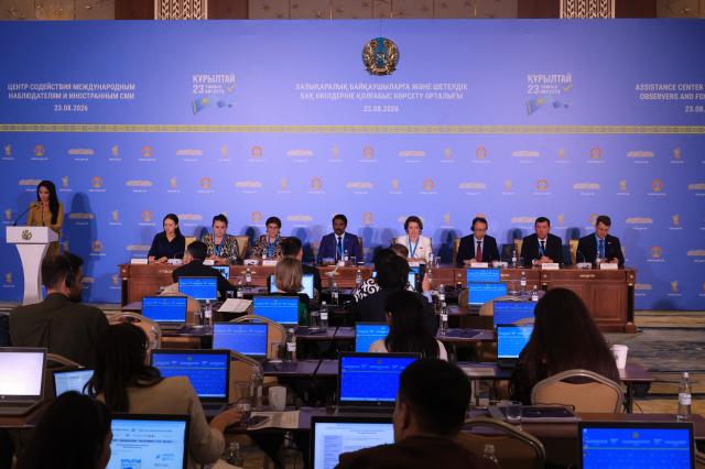International election observers attend a briefing at the Assistance Center for International Observers and Foreign Media in Astana on Aug 23 2026 as Kazakhstan held its first parliamentary election for the new single-chamber Kurultai Journalists are seen in the foreground AJP Han Jun-gu